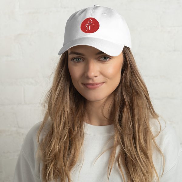A female wearing a white baseball hat with the Premier Pain Treatment Institute logo on the front