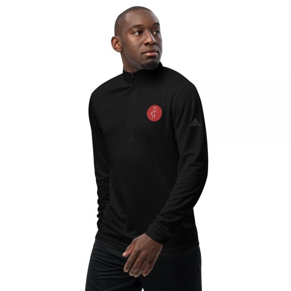 A man wearing a black Adidas long sleeve shirt with the Premier Pain Treatment Institute logo on the front